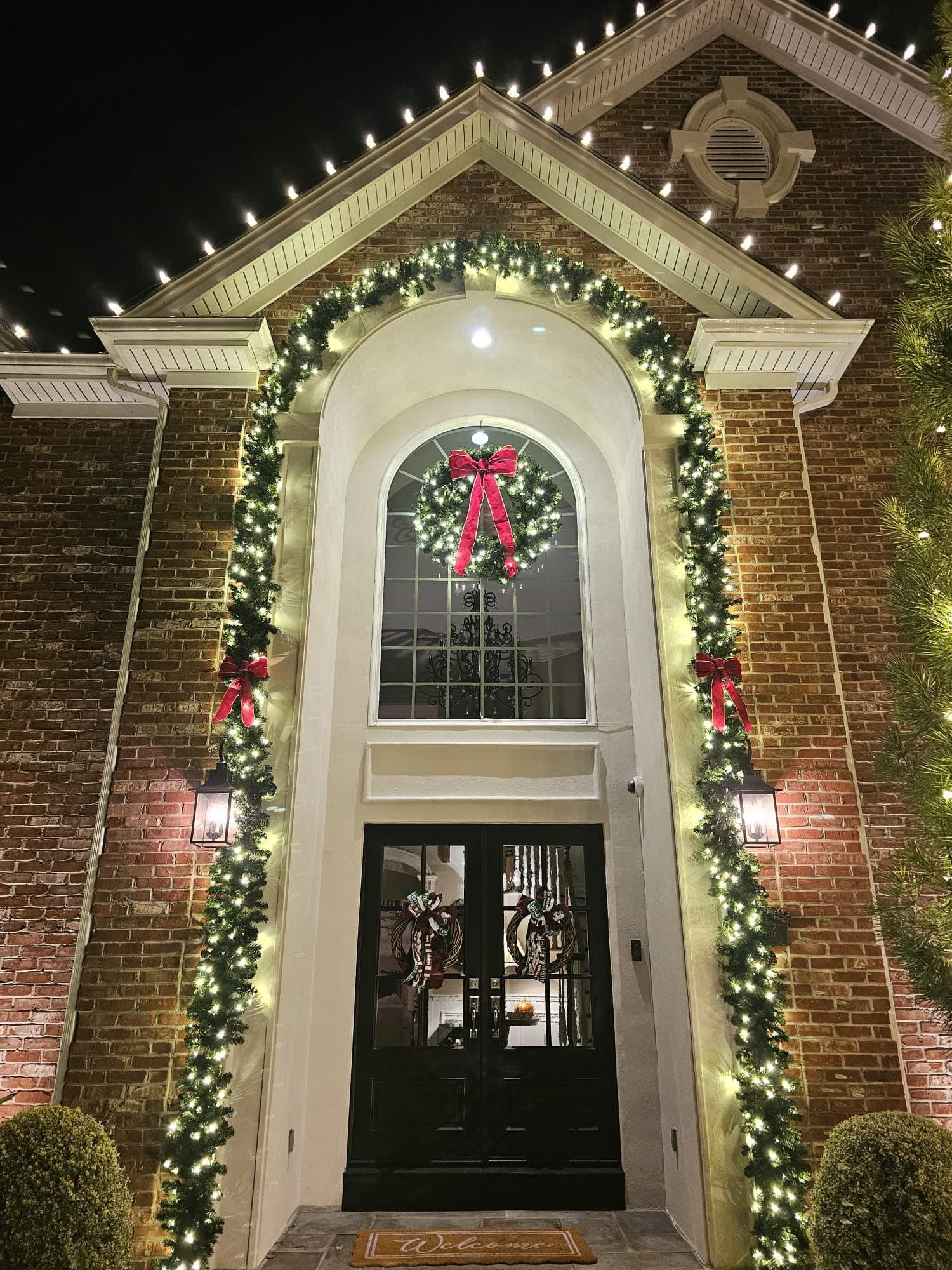 Christmas lights on roofline and windows